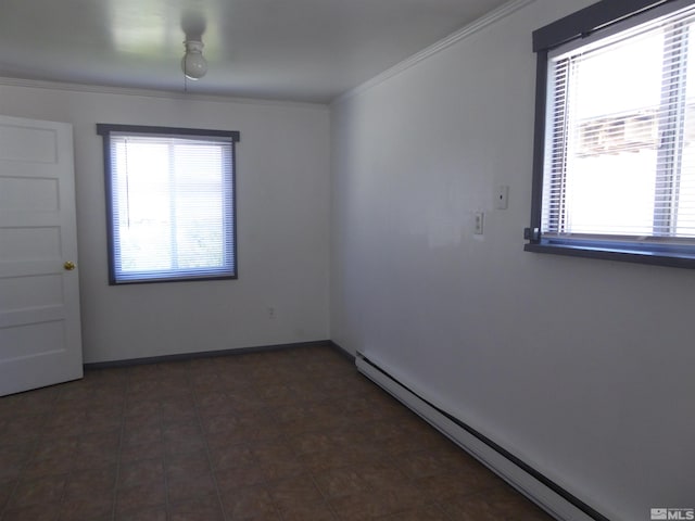 tiled spare room with a baseboard radiator and crown molding