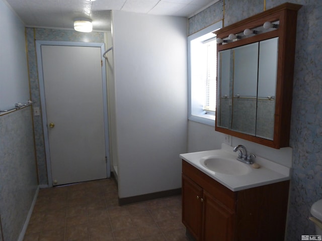 bathroom with tile flooring, toilet, and vanity