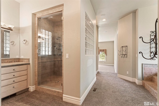 hallway featuring dark colored carpet