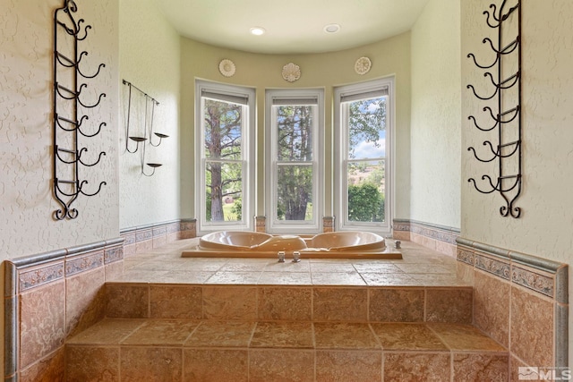 bathroom with tiled bath