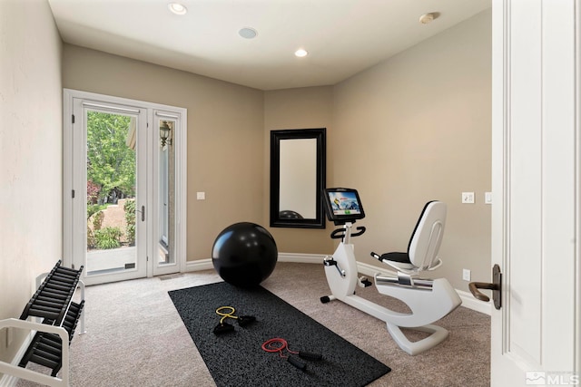 exercise room with light carpet