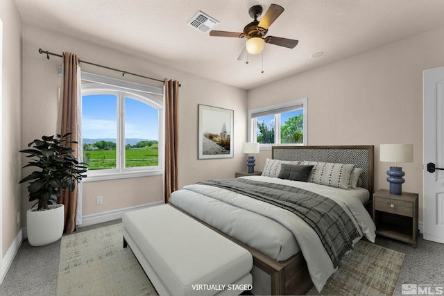 carpeted bedroom featuring ceiling fan