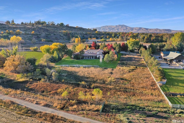 birds eye view of property featuring a mountain view