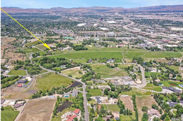 drone / aerial view featuring a mountain view