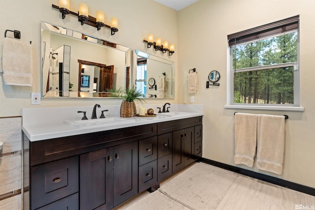 bathroom featuring tile flooring, oversized vanity, and double sink