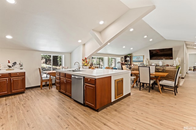 kitchen with stainless steel dishwasher, light hardwood / wood-style flooring, a kitchen island with sink, sink, and vaulted ceiling