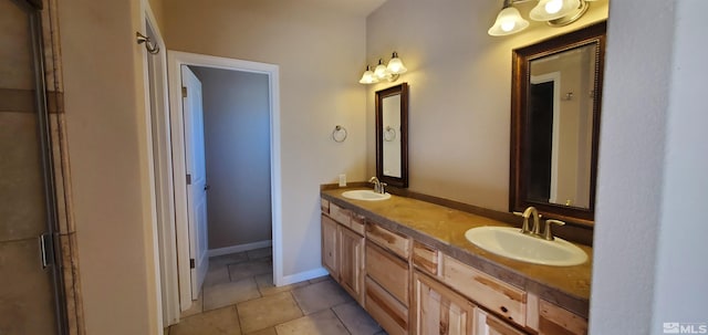 bathroom featuring dual bowl vanity and tile flooring