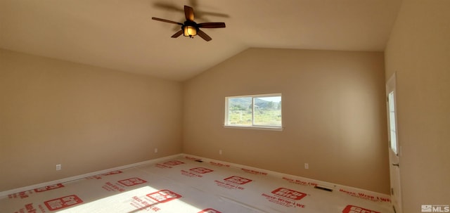 carpeted spare room with lofted ceiling and ceiling fan