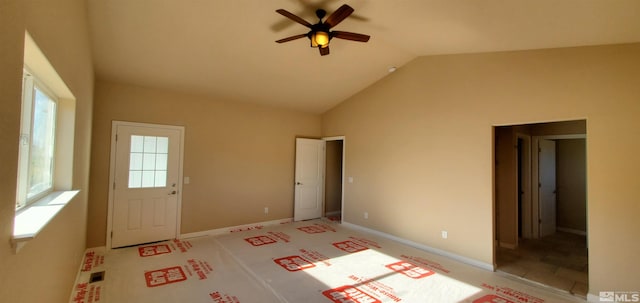 interior space featuring vaulted ceiling and ceiling fan