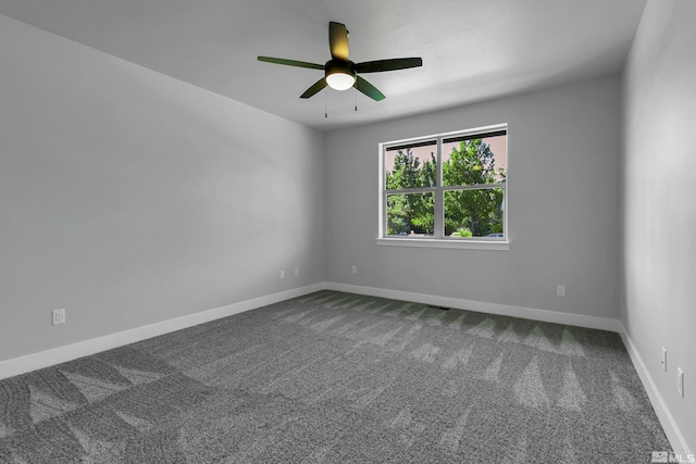 carpeted empty room featuring ceiling fan