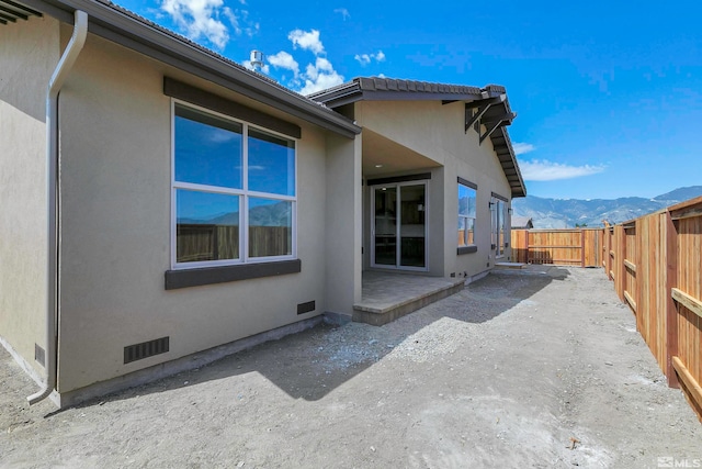 exterior space featuring a patio area and a mountain view