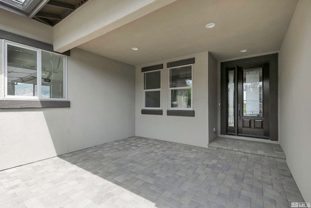 property entrance with a patio