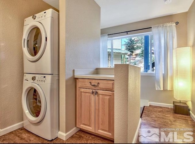 washroom with stacked washer and clothes dryer