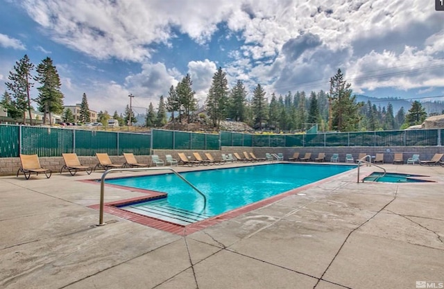 view of swimming pool with a patio area