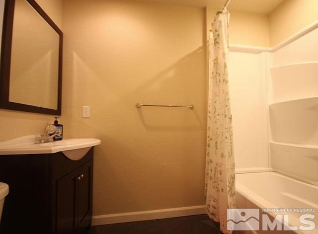 bathroom featuring vanity and shower / bath combo with shower curtain