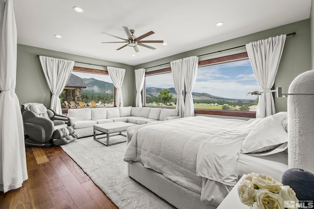 bedroom featuring ceiling fan and hardwood / wood-style floors