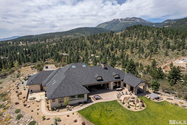 birds eye view of property featuring a mountain view