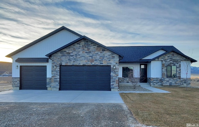 view of front of house with a front yard and a garage