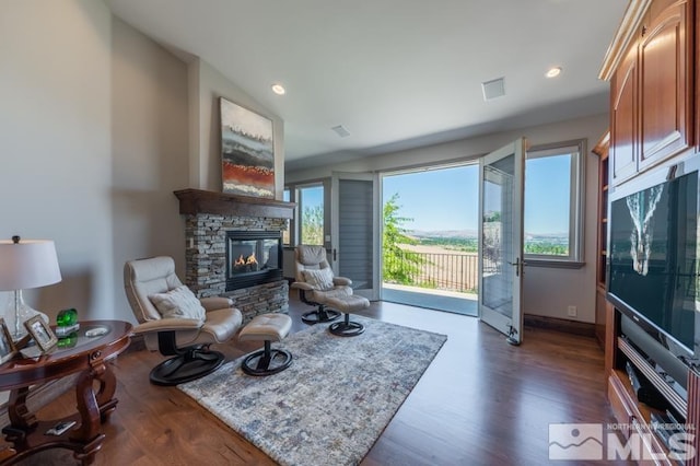 interior space featuring a fireplace and dark hardwood / wood-style floors