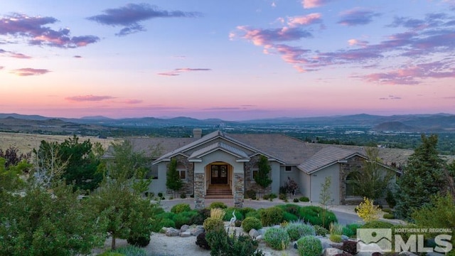 view of front of home featuring a mountain view