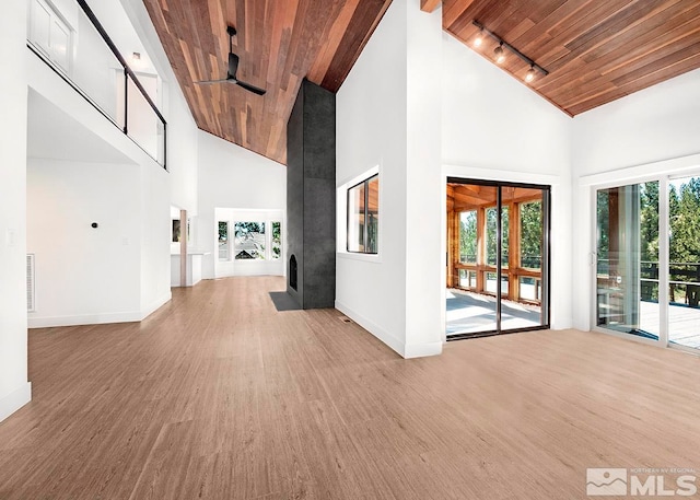 hallway with high vaulted ceiling, wooden ceiling, wood-type flooring, and track lighting