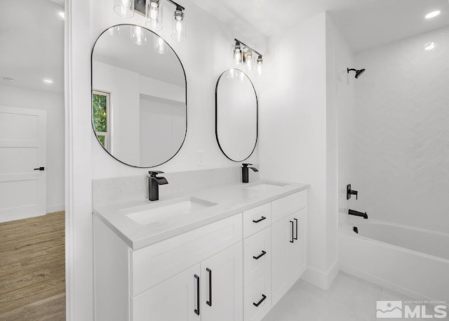 bathroom with dual bowl vanity, tile flooring, and tub / shower combination