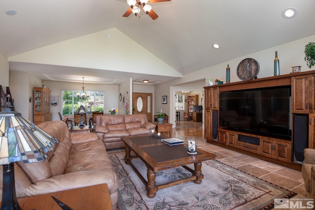 tiled living room with high vaulted ceiling and ceiling fan with notable chandelier