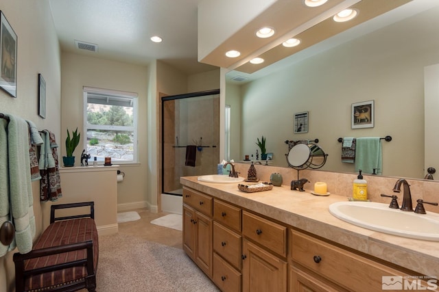 bathroom with dual vanity and tile flooring