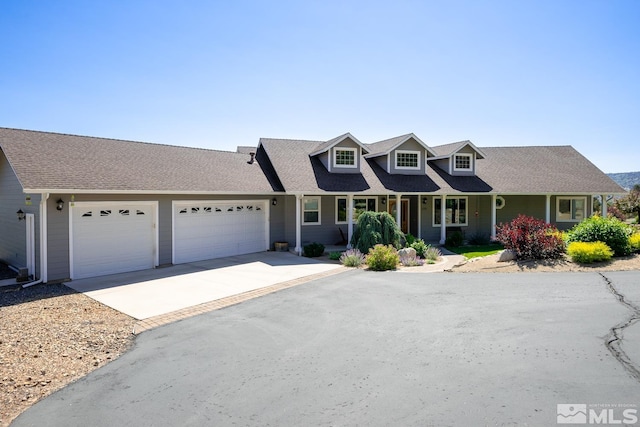 new england style home with a garage