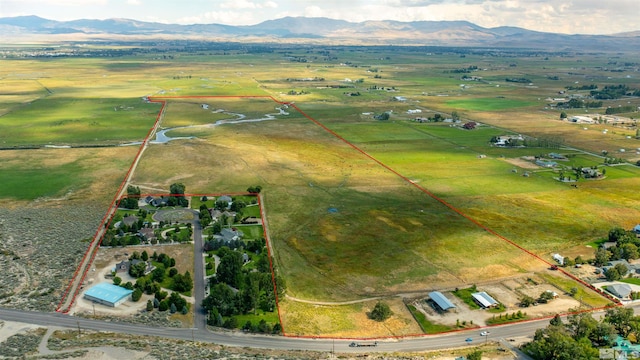 birds eye view of property featuring a rural view and a mountain view