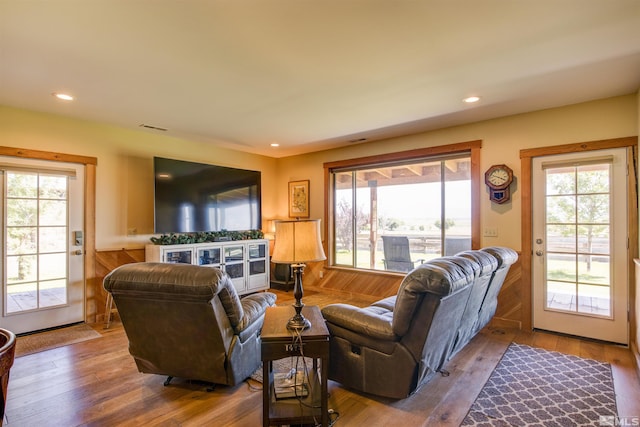 living room with plenty of natural light and hardwood / wood-style flooring