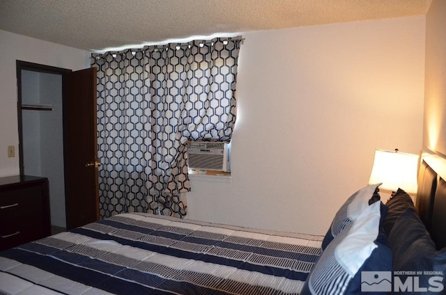 bedroom featuring a textured ceiling