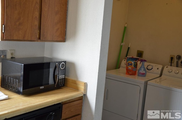 laundry room featuring separate washer and dryer