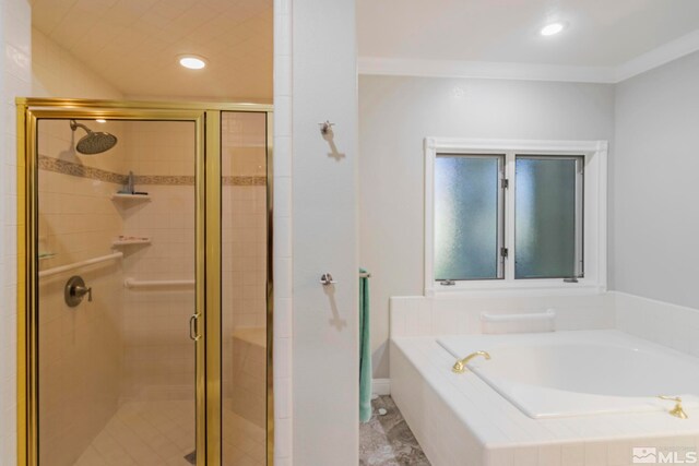 bathroom with tile floors and independent shower and bath