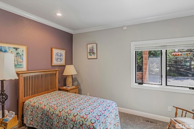 bedroom featuring ornamental molding and dark colored carpet