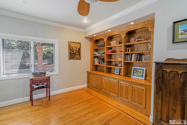 miscellaneous room featuring ornamental molding, ceiling fan, and light hardwood / wood-style flooring