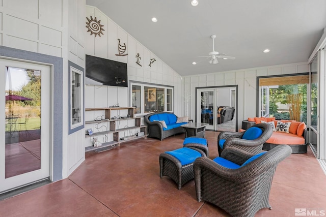 interior space featuring ceiling fan, lofted ceiling, and french doors