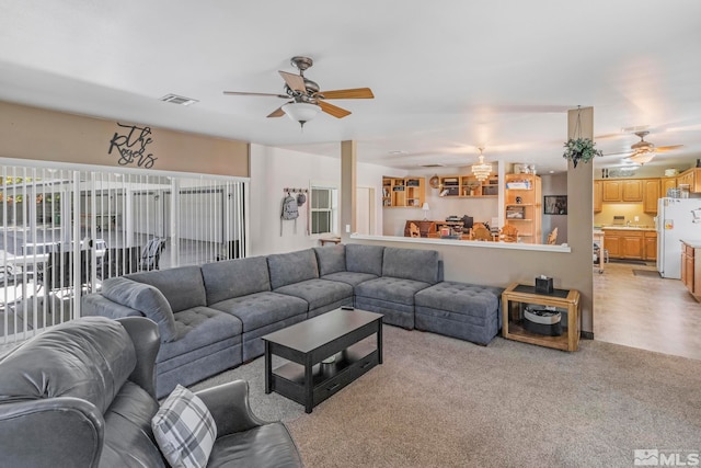 tiled living room featuring ceiling fan