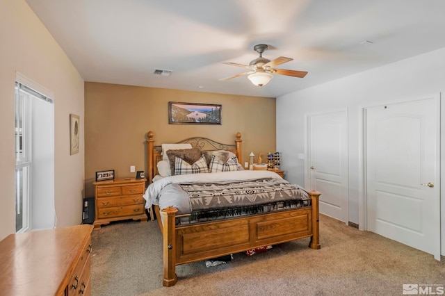 bedroom featuring ceiling fan and light colored carpet