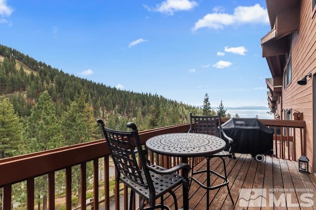 wooden deck featuring area for grilling