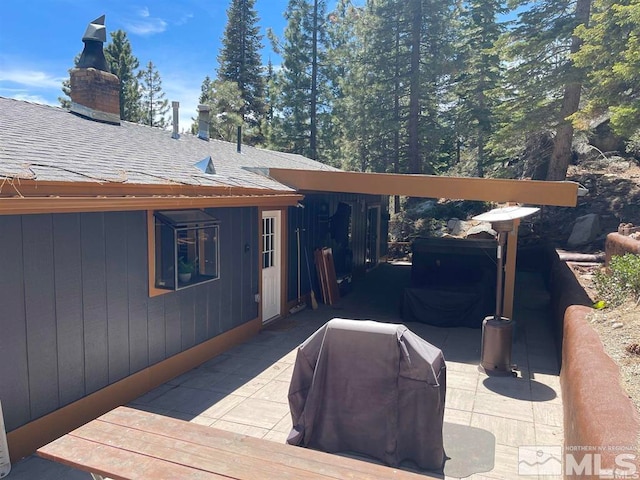 wooden terrace with area for grilling