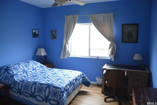 bedroom featuring light hardwood / wood-style floors and ceiling fan