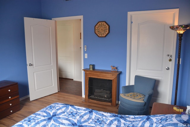 bedroom with light hardwood / wood-style floors