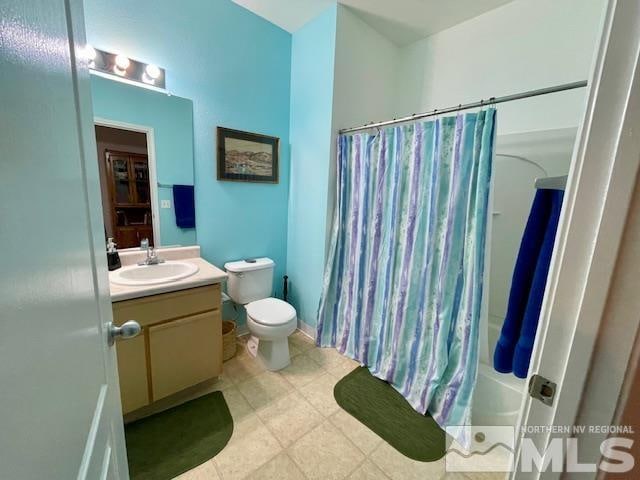 full bathroom with toilet, shower / bathtub combination with curtain, tile floors, and oversized vanity