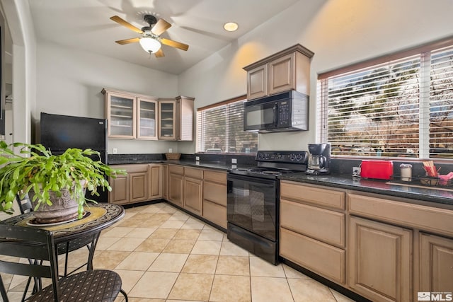 kitchen with ceiling fan, plenty of natural light, black appliances, and light tile floors