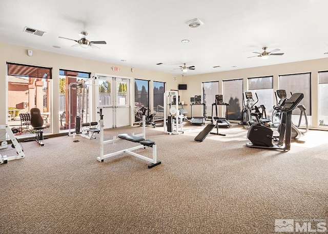 exercise room with light carpet, ceiling fan, and french doors