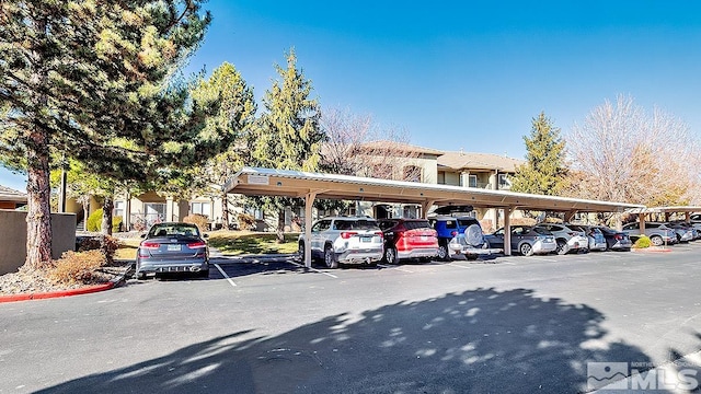 view of vehicle parking with a carport