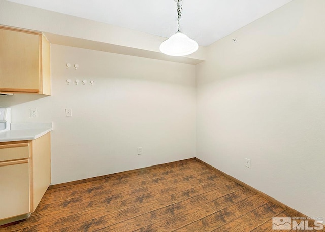 unfurnished room featuring dark hardwood / wood-style flooring