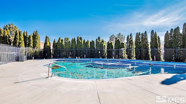 view of swimming pool featuring a patio area