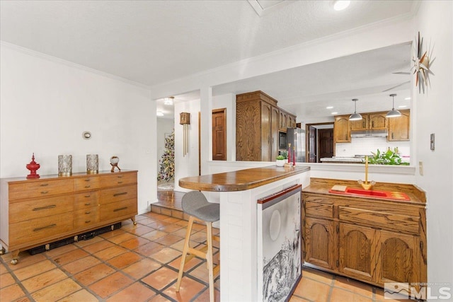 kitchen with a breakfast bar, decorative light fixtures, kitchen peninsula, and light tile flooring